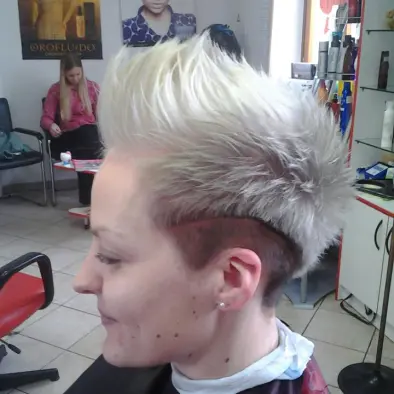 Client getting a modern haircut in a salon